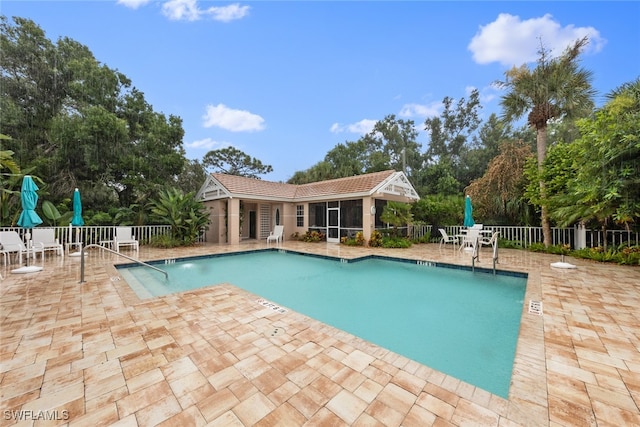 view of swimming pool with a patio