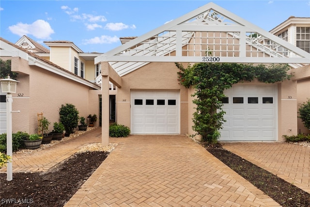 view of front of property featuring a garage