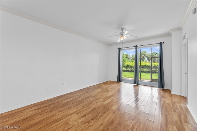 spare room with light wood-type flooring, ceiling fan, and crown molding