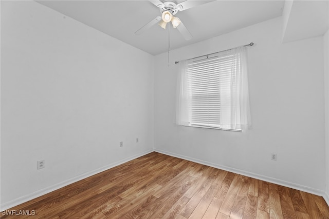 empty room with wood-type flooring and ceiling fan