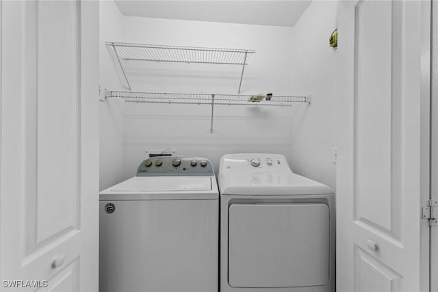 laundry room featuring washing machine and dryer