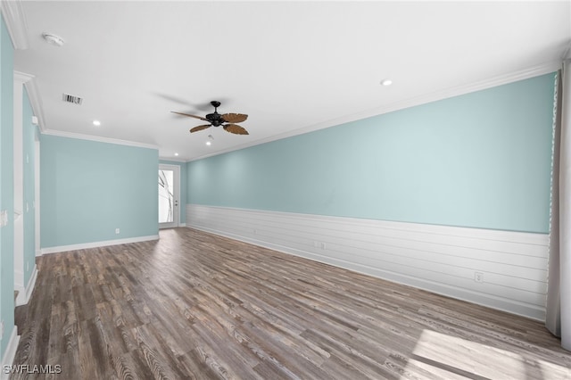 spare room with ceiling fan, crown molding, and wood-type flooring