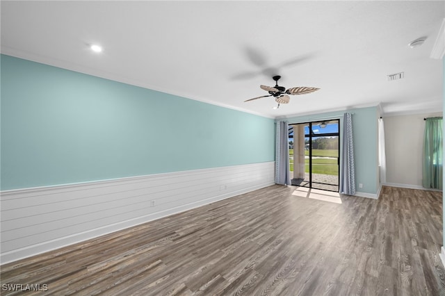 unfurnished room featuring ceiling fan, ornamental molding, and wood-type flooring