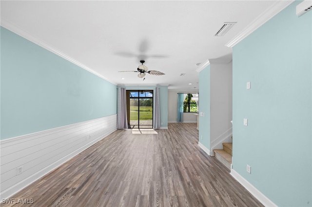 unfurnished room featuring ceiling fan, ornamental molding, and hardwood / wood-style floors