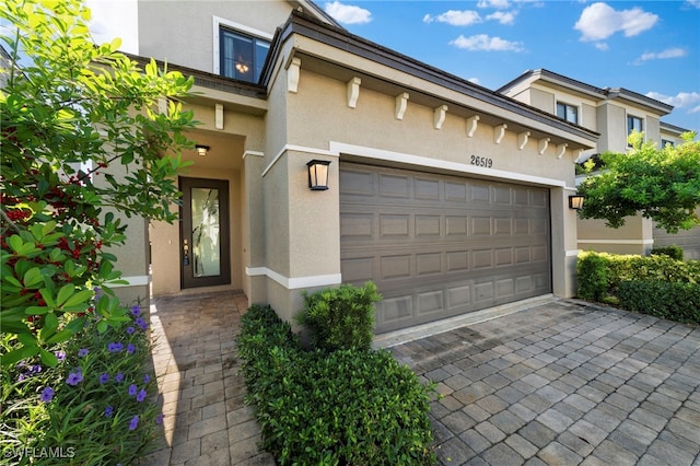 view of front of property with a garage