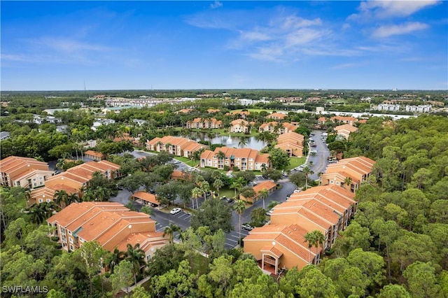 birds eye view of property with a residential view and a water view