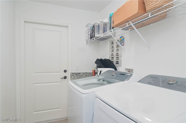 washroom with independent washer and dryer