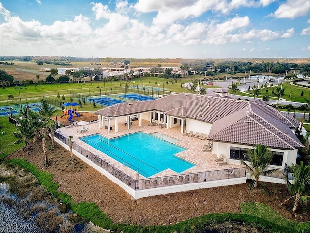 view of swimming pool with a patio