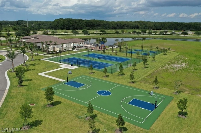 view of sport court with a tennis court, community basketball court, a water view, and fence