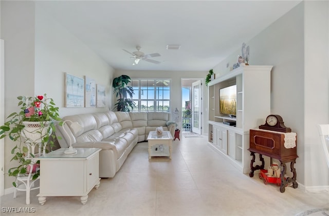 living room with light tile patterned floors and ceiling fan