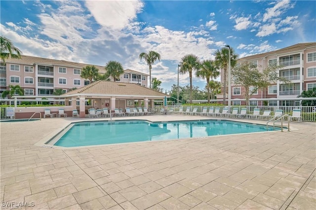 11741 Pasetto Ln Unit 404, Fort Myers, FL 33908 - community pool with fence and a patio area