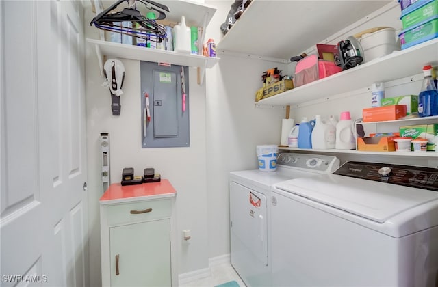 clothes washing area featuring independent washer and dryer and electric panel