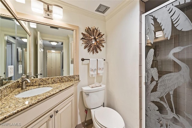 bathroom with vanity, toilet, a shower with shower door, and crown molding