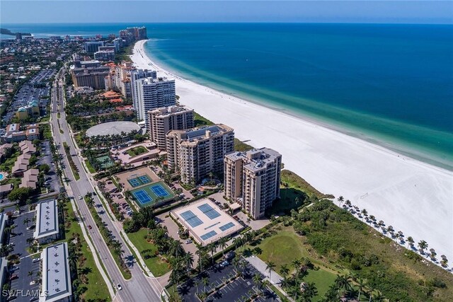 bird's eye view featuring a water view and a view of the beach