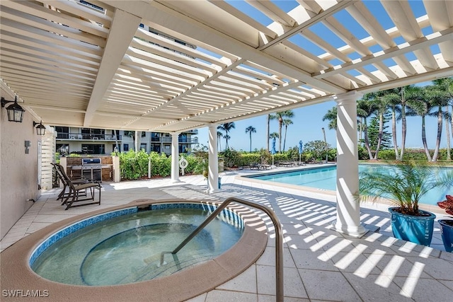 view of pool with a patio, a pergola, and a hot tub