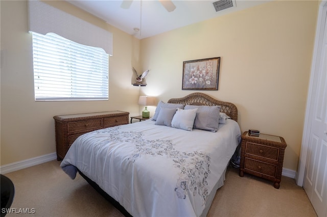 carpeted bedroom with ceiling fan