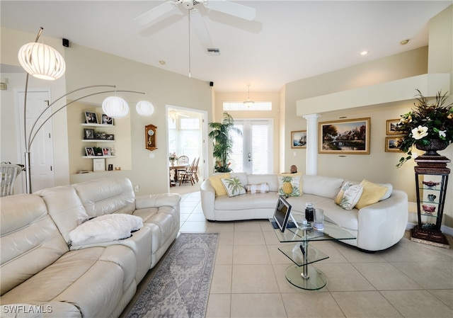 tiled living room with ceiling fan