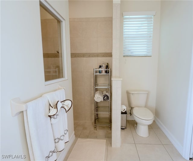 bathroom featuring toilet and tile patterned floors