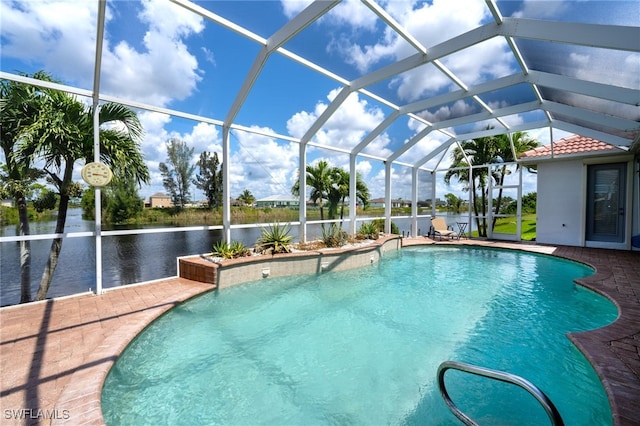 view of swimming pool featuring a water view, a patio, and a lanai