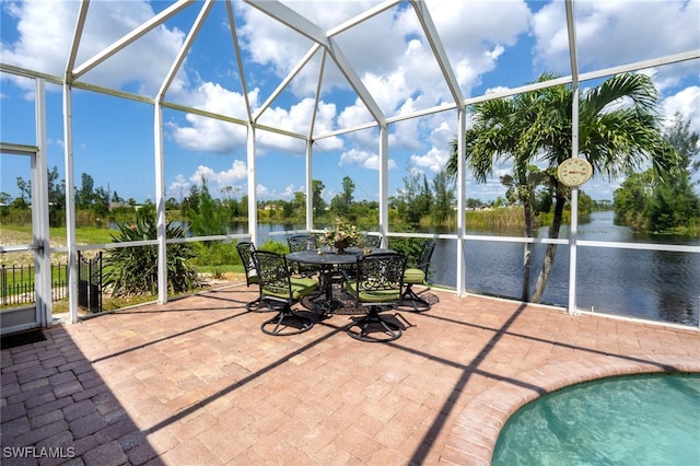 unfurnished sunroom featuring a water view