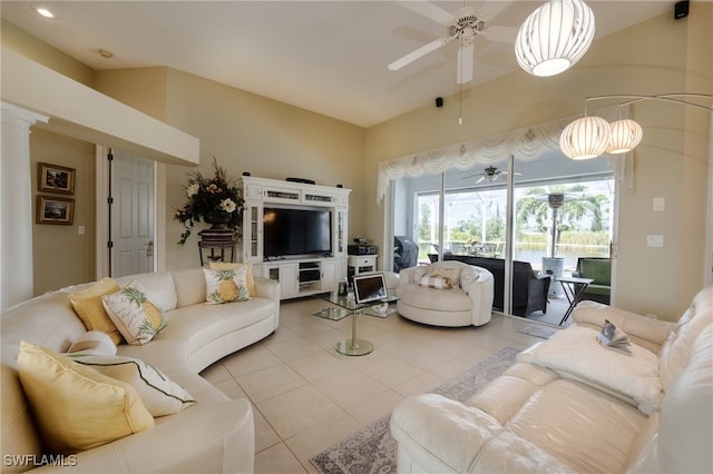 living room with ceiling fan, lofted ceiling, and light tile patterned floors