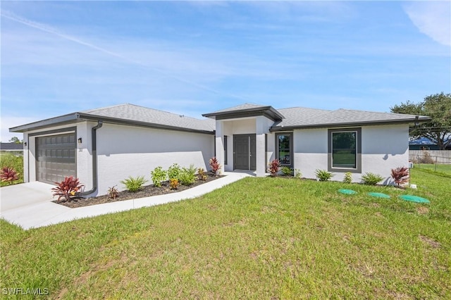 2611 NE 22nd Ave, Cape Coral, FL 33909 - prairie-style home featuring stucco siding, an attached garage, a front lawn, and concrete driveway