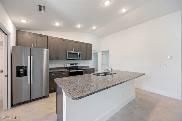 kitchen featuring sink, dark brown cabinets, appliances with stainless steel finishes, and vaulted ceiling