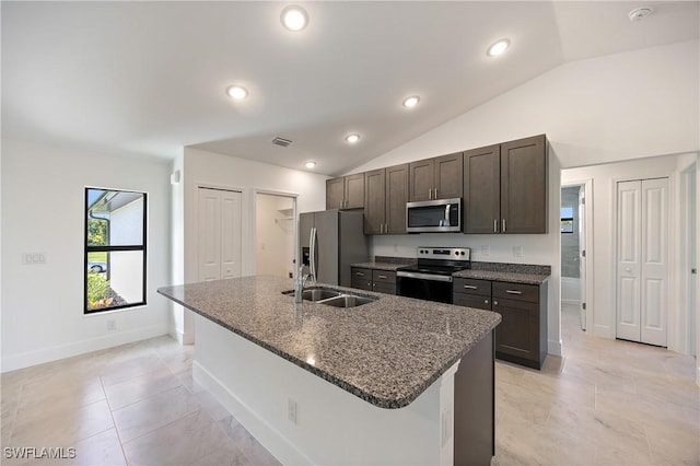 2611 NE 22nd Ave, Cape Coral, FL 33909 - kitchen with appliances with stainless steel finishes, a sink, lofted ceiling, a kitchen island with sink, and dark brown cabinets