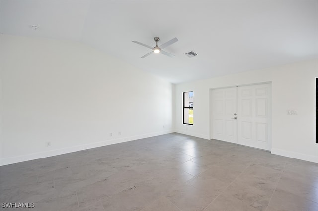 spare room with ceiling fan and lofted ceiling