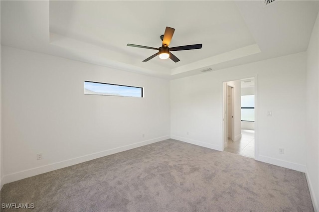 2611 NE 22nd Ave, Cape Coral, FL 33909 - unfurnished room with a raised ceiling, a ceiling fan, carpet, and baseboards