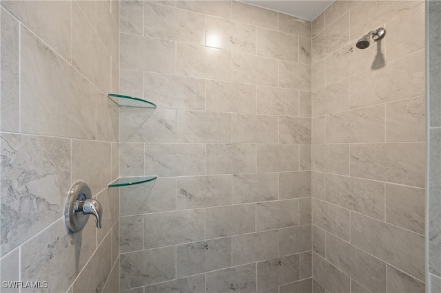 bathroom with tiled shower