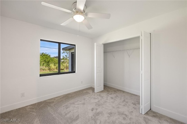 2611 NE 22nd Ave, Cape Coral, FL 33909 - unfurnished bedroom featuring carpet floors, baseboards, a closet, and a ceiling fan