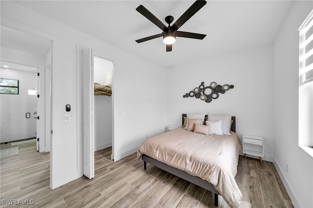 bedroom with light wood-type flooring and ceiling fan