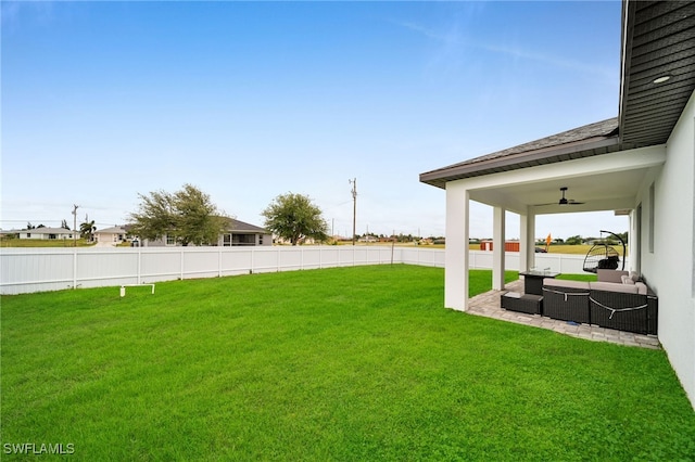 view of yard with a patio area, ceiling fan, and an outdoor hangout area