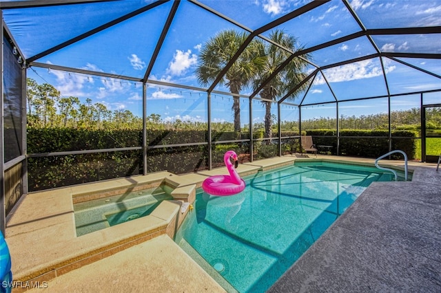 view of pool featuring an in ground hot tub, a patio, and a lanai