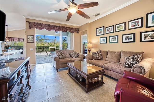 tiled living room featuring ornamental molding and ceiling fan