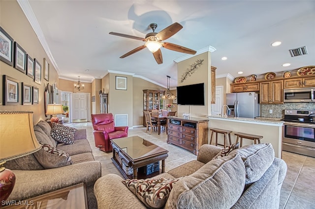 tiled living room with crown molding, sink, and ceiling fan with notable chandelier