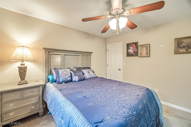 carpeted bedroom with ceiling fan