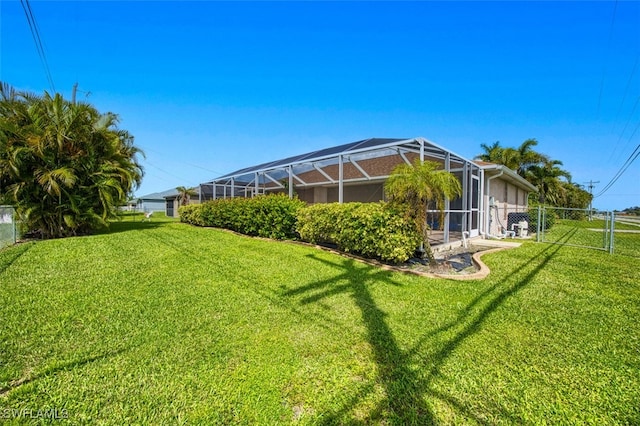 view of yard featuring glass enclosure