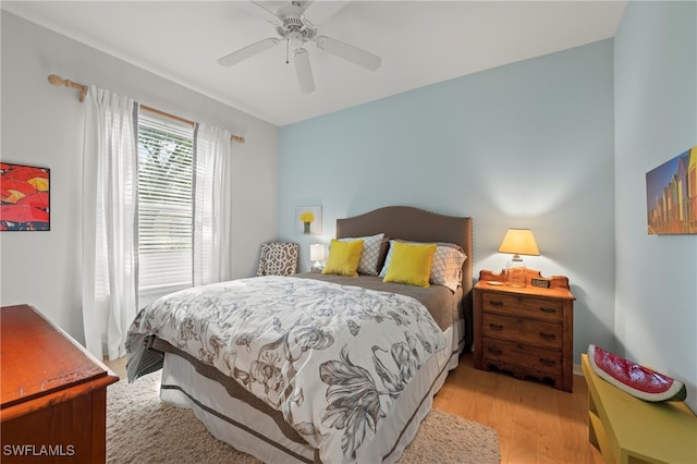 bedroom featuring light hardwood / wood-style flooring and ceiling fan