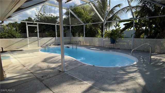 view of pool featuring a lanai and a patio area