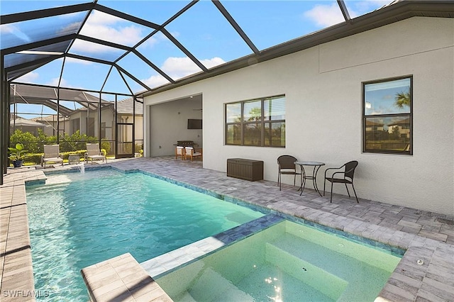 view of swimming pool featuring glass enclosure, pool water feature, and a patio