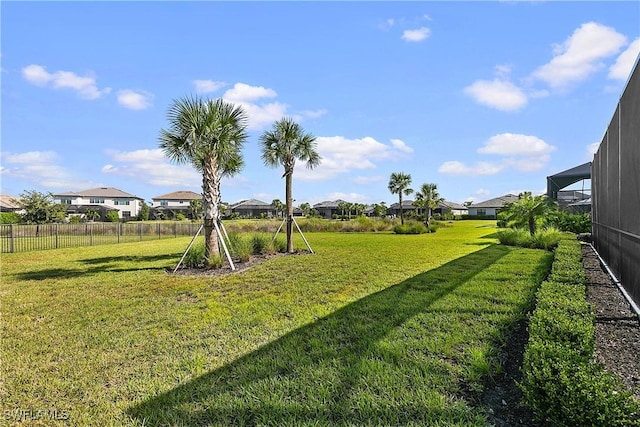 view of yard featuring a lanai