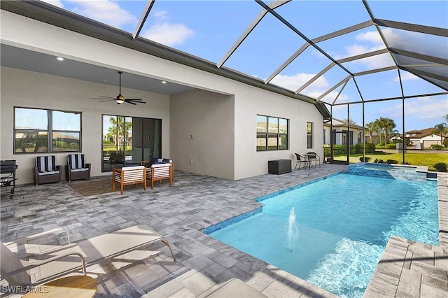 view of swimming pool with ceiling fan, a lanai, an outdoor hangout area, pool water feature, and a patio