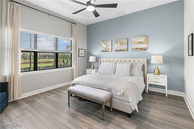 bedroom with hardwood / wood-style floors and ceiling fan