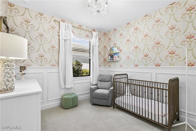 bedroom with carpet floors and a crib