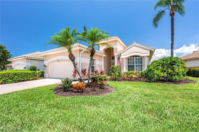 24800 Hollybrier Ln, Bonita Springs, FL 34134 - mediterranean / spanish home with an attached garage, a front lawn, stucco siding, driveway, and a tile roof