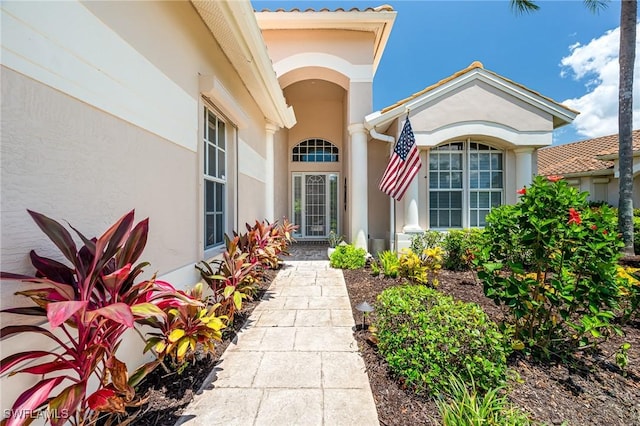 24800 Hollybrier Ln, Bonita Springs, FL 34134 - doorway to property featuring stucco siding