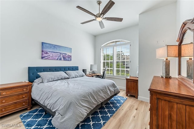 bedroom with light hardwood / wood-style floors and ceiling fan