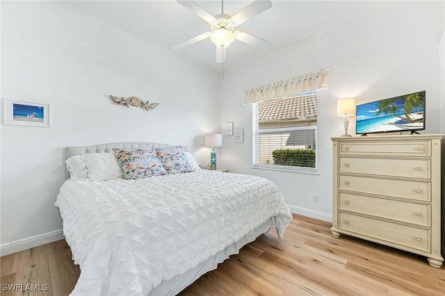 bedroom with ceiling fan and light hardwood / wood-style floors